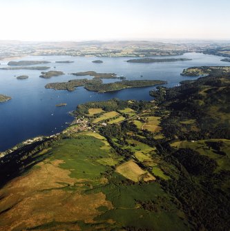 General oblique aerial view looking across the village of Luss and Loch Lomond towards Gartocharn, taken from the WNW.