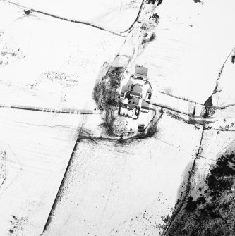Oblique aerial view centred on the farmsteading with rig adjacent, taken from the SSW