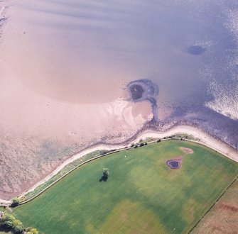 Oblique aerial view centred on the remains of the fish trap and possible ballast mound, taken from the NW.
