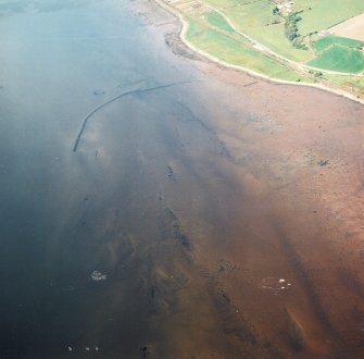 Oblique aerial view centred on the remains of the fish traps, taken from the SE.