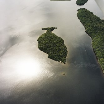 Oblique aerial view centred on Clairinsh Island with crannog adjacent, taken from the NE.