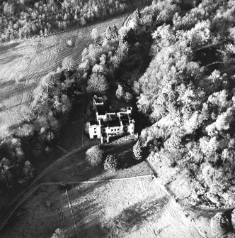 Oblique aerial view centred on the remains of the country house, taken from the SE.