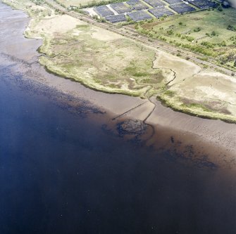 Oblique aerial view centred on the remains of the Dumbuck crannog, taken from the SE.