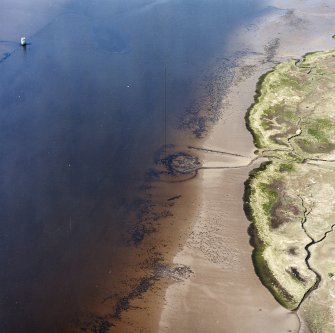 Oblique aerial view centred on the remains of the Dumbuck  crannog, taken from the E.