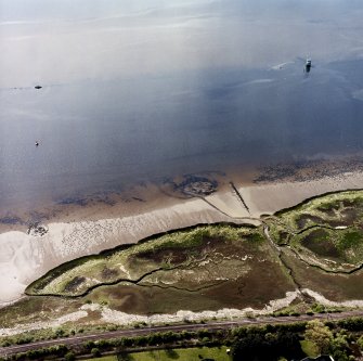 Oblique aerial view centred on the remains of the Dumbuck  crannog, taken from the NNE.
