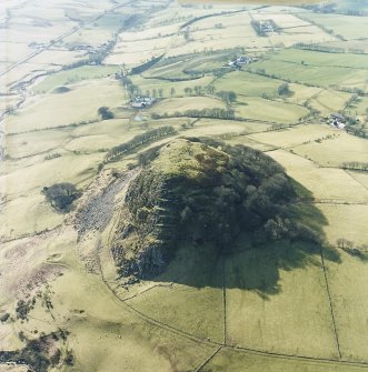 Oblique aerial view centred on Loudoun Hill with the railway viaduct adjacent, taken from the ENE.