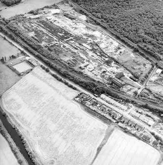 Oblique aerial view centred on the cropmarks of the Antonine Wall, taken from the WNW.