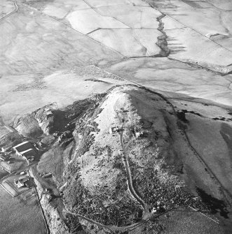 Oblique aerial view centred on the radio station and the remains of the fort with the quarry adjacent, taken from the E.