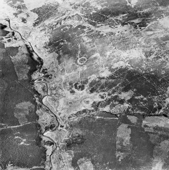 Oblique aerial view centred on the remains of sheepfolds, taken from the NE.
