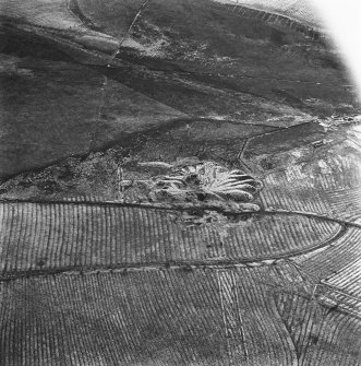 Lochend Colliery, oblique aerial view, taken from the NW, showing Lochend Colliery coal mine in the centre of the photograph, and an area of rig with overlying plantation banks to the bottom.