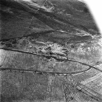 Lochend Colliery, oblique aerial view, taken from the NNW, showing Lochend Colliery coal mine in the centre of the photograph, and an area of rig with overlying plantation banks to the bottom.