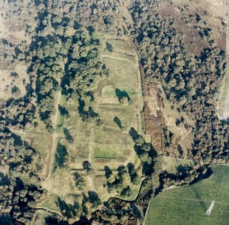 Oblique aerial view of Rough Castle centred on the remains of a Roman fort and the Antonine wall, taken from the WSW.