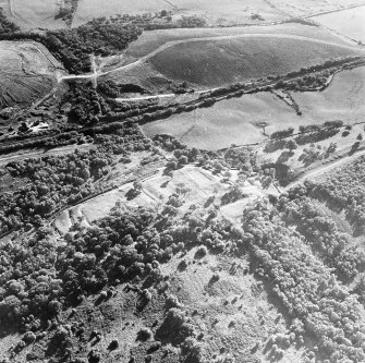 Oblique aerial view of Rough Castle centred on the remains of a Roman fort and the Antonine wall, taken from the NNE.