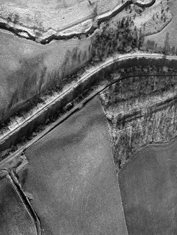 Aerial view of the Antonine Wall and site of the fortlet at Seabegs Wood from the south, centred c. NS 8113 7921.