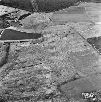 Gair and Bogside, oblique aerial view, taken from the SW, showing rig and furrow cultivation in the centre of the photograph, and Bogside farmstead in the bottom right-hand corner.