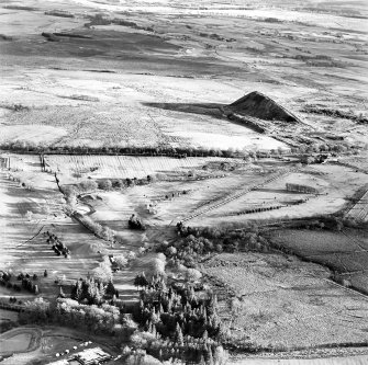 Oblique aerial view centred on the remains of rig with coal mines adjacent, taken from the WNW.