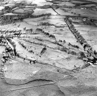 Oblique aerial view centred on the remains of rig, taken from the SW.