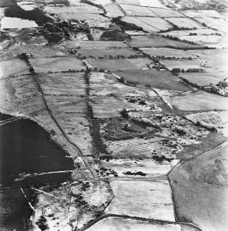 Strathavon and Nappyfaulds, oblique aerial view, taken from the W, showing Nappyfaulds farmstead and an area of rig in the centre of the photograph and Strathavon coal mines and a mineral railway in the top right-hand corner.