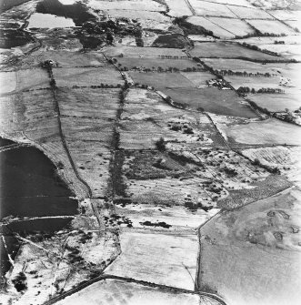 Strathavon and Nappyfaulds, oblique aerial view, taken from the W, showing Nappyfaulds farmstead and an area of rig in the centre of the photograph and Strathavon coal mines and a mineral railways in the top right-hand corner.