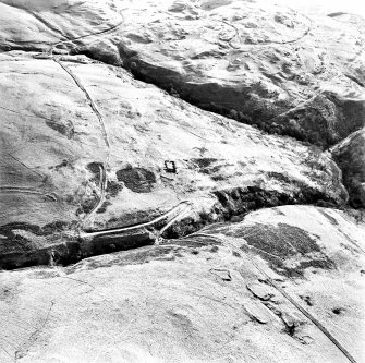 Oblique aerial view of Third and Second Inchna Burns centred on the remains of an archaeological landscape, taken from the NNW.