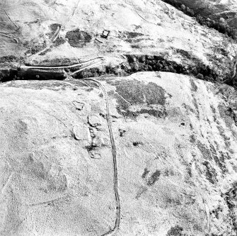 Oblique aerial view of Third and Second Inchna Burns centred on the remains of an archaeological landscape, taken from the NW.