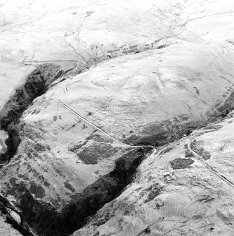 Oblique aerial view of Third Inchna Burn centred on an archaeological landscape, taken from the SSE.