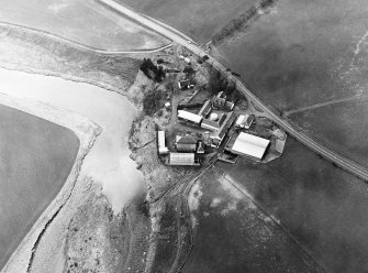 Oblique aerial view centred on the remains of the motte, taken from the ENE.