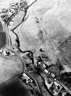 Oblique aerial view centred on the remains of the possible fort with the footbridge adjacent, taken from the ESE.