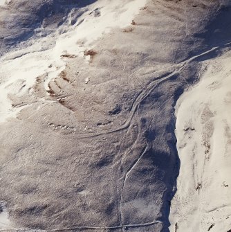 Oblique aerial view centred on the remains of the Roman Road, taken from the E.