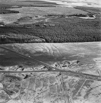 Rashiehill Muir and Miller's Moss, oblique aerial view, taken from the W, showing quarries in the bottom half, and Miller's Moss road leaving the bottom edge of the photograph.
