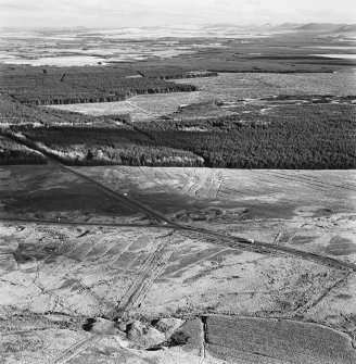 Rashiehill Muir and Miller's Moss, oblique aerial view, taken from the WNW, showing quarries in the centre and right of the photograph, and Miller's Moss road passing between further quarries and a sheepfold in the bottom left-hand corner.