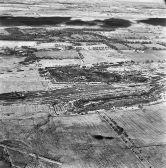 Polkemmet Colliery, oblique aerial view, taken from the S, showing spoil heaps associated with the coal mine across the centre of the photograph.
