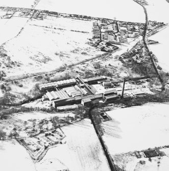 Oblique aerial view centred on the paper mill, taken from the ENE.