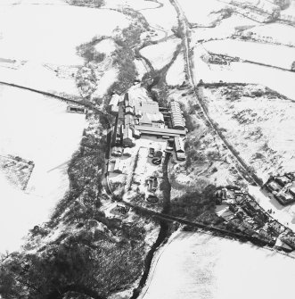 Oblique aerial view centred on the paper mill, taken from the NNW.