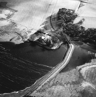Cairns Castle Tower and Broom Hill, oblique aerial view, taken from the NW, showing the tower in the centre of the photograph beside the house, and an area of rig and furrow cultivation in adjacent fields.