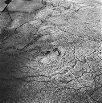 Tarbrax Shale-Oil Works, oblique aerial view, taken from the ESE, showing the remains of the shale-oil mine and a tramway leading up to it in the centre of the photograph.