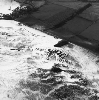 Oblique aerial view of the village and the remains of the fort, cultivation terraces and enclosure, taken from the E.