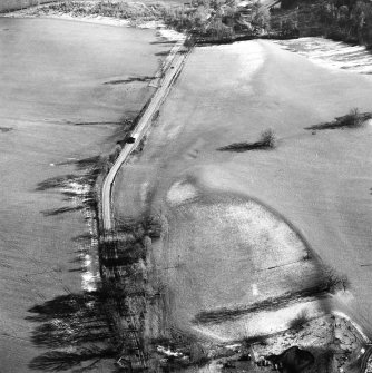 Castle Craig, oblique aerial view, taken from the WNW, showing the traces of an old road running up the centre of the photograph.