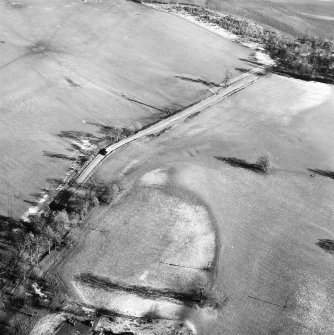 Castle Craig, oblique aerial view, taken from the WSW, showing the traces of an old road running up the centre of the photograph.