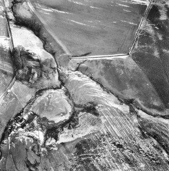 Oblique aerial photograph centred on cultivation terraces and cultivation remains from SW.