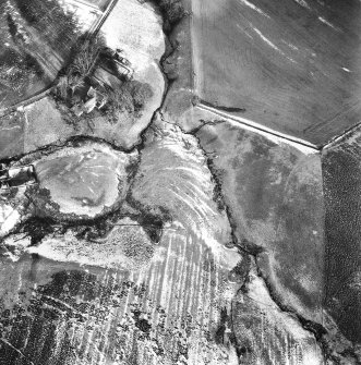 Oblique aerial photograph centred on cultivation terraces and cultivation remains from SSW.