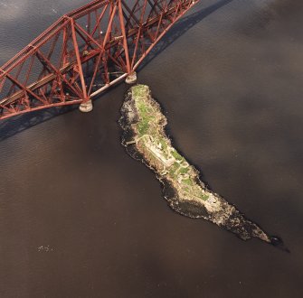 Oblique aerial view of The Forth Bridge and Inch Garvie centred on the rail bridge and the remains of a castle, battery, coast battery and artillery fortifications, taken from the ESE.