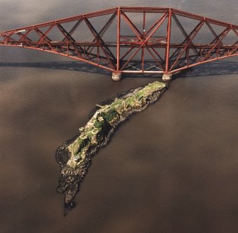 Oblique aerial view of The Forth Bridge and Inch Garvie centred on the rail bridge and the remains of a castle, battery, coast battery and artillery fortifications, taken from the ENE.