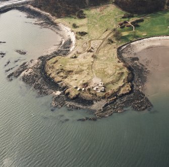 Oblique aerial view of Charles Hill centred on the remains of a coast battery and military camp with a ferry-house cellar adjacent, taken from the E.