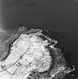 Oblique aerial view of Charles Hill centred on a coast battery with a ferry-house cellar adjacent, taken from the SW.