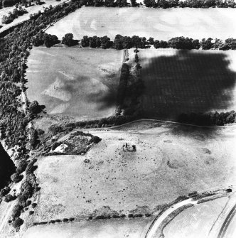 Horsburgh Castle, oblique aerial view, taken from the E, centred on the Tower surrounded by the cropmarks of a fort. The SW corners of Eshiels Roman Temporary Camps are visible in the top right-hand corner of the photograph.