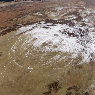 White Meldon, oblique aerial view, taken from the SSE, centred on the fort and a cairn.
