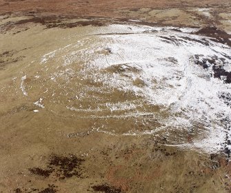 White Meldon, oblique aerial view, taken from the ESE, centred on the fort and a cairn.