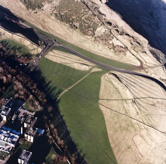 Oblique aerial view of Holyrood Park centred on the remains of cultivation, taken from the SE.