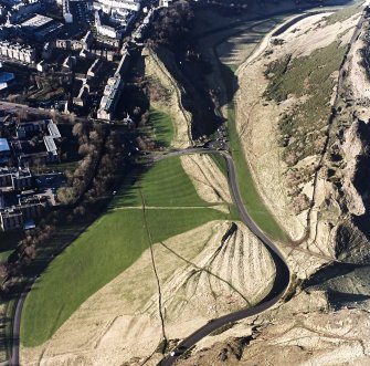 Oblique aerial view of Holyrood Park centred on the remains of cultivation, taken from the ESE.